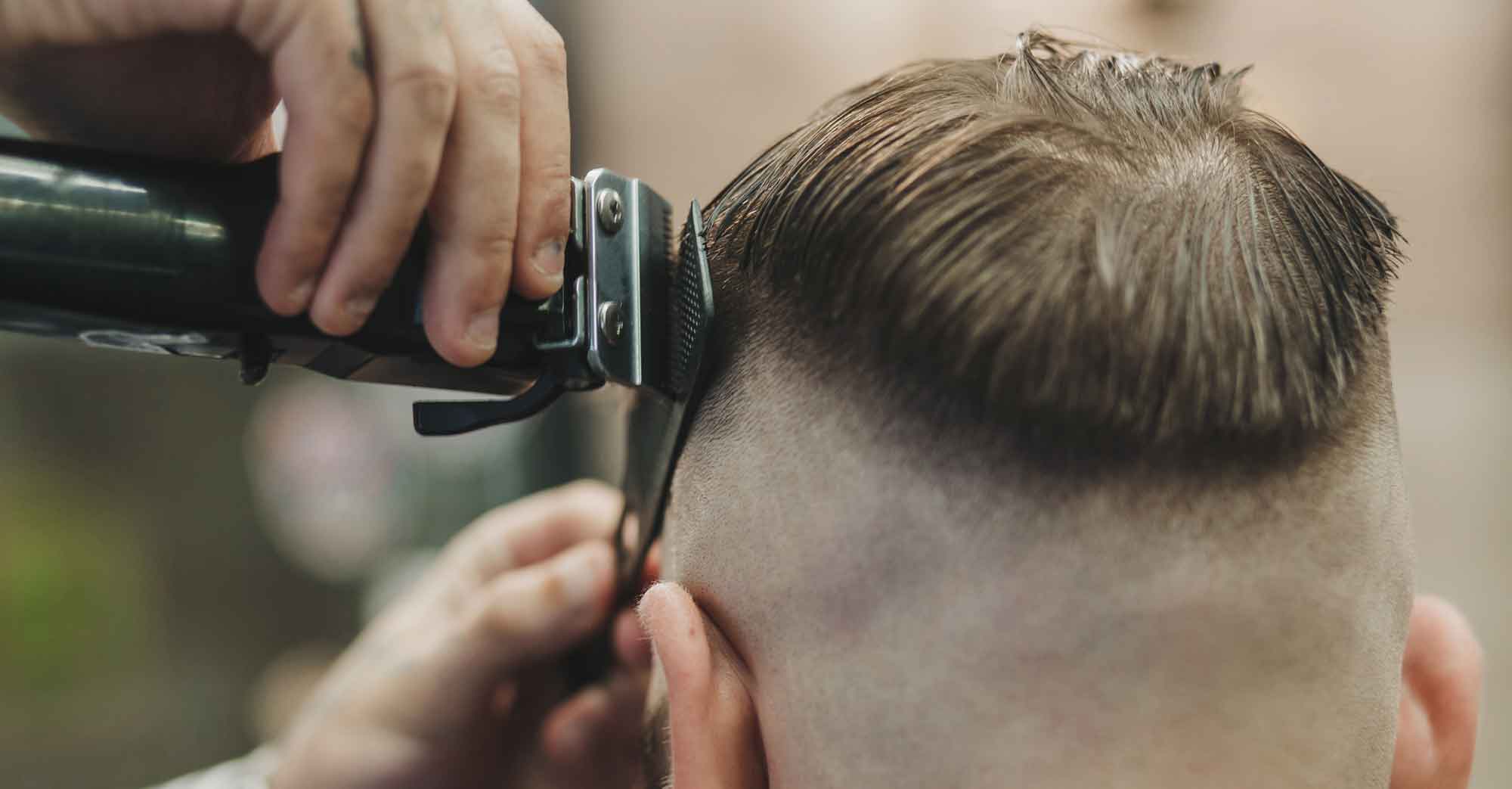 Man getting a barber fade