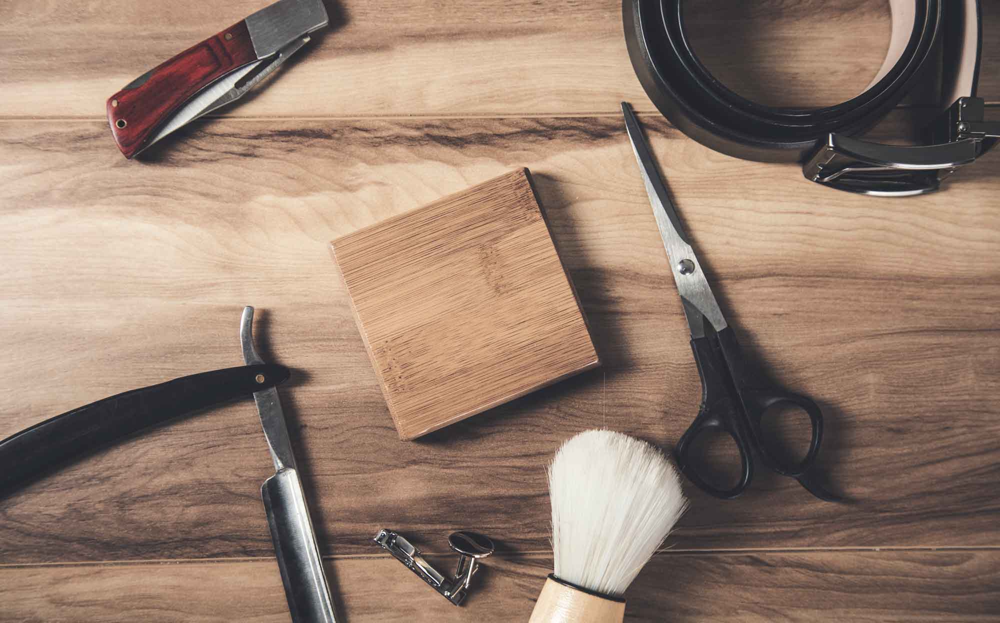 Barber utensils displayed on a wooden table