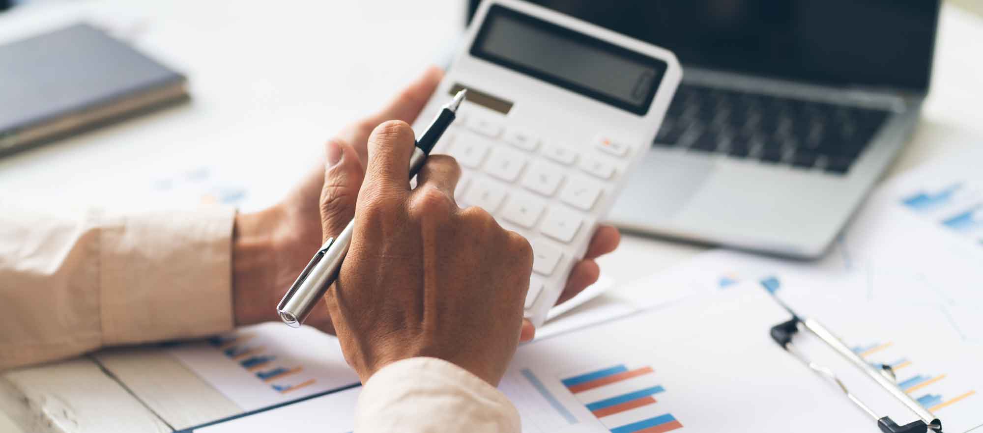 A person holding a calculator