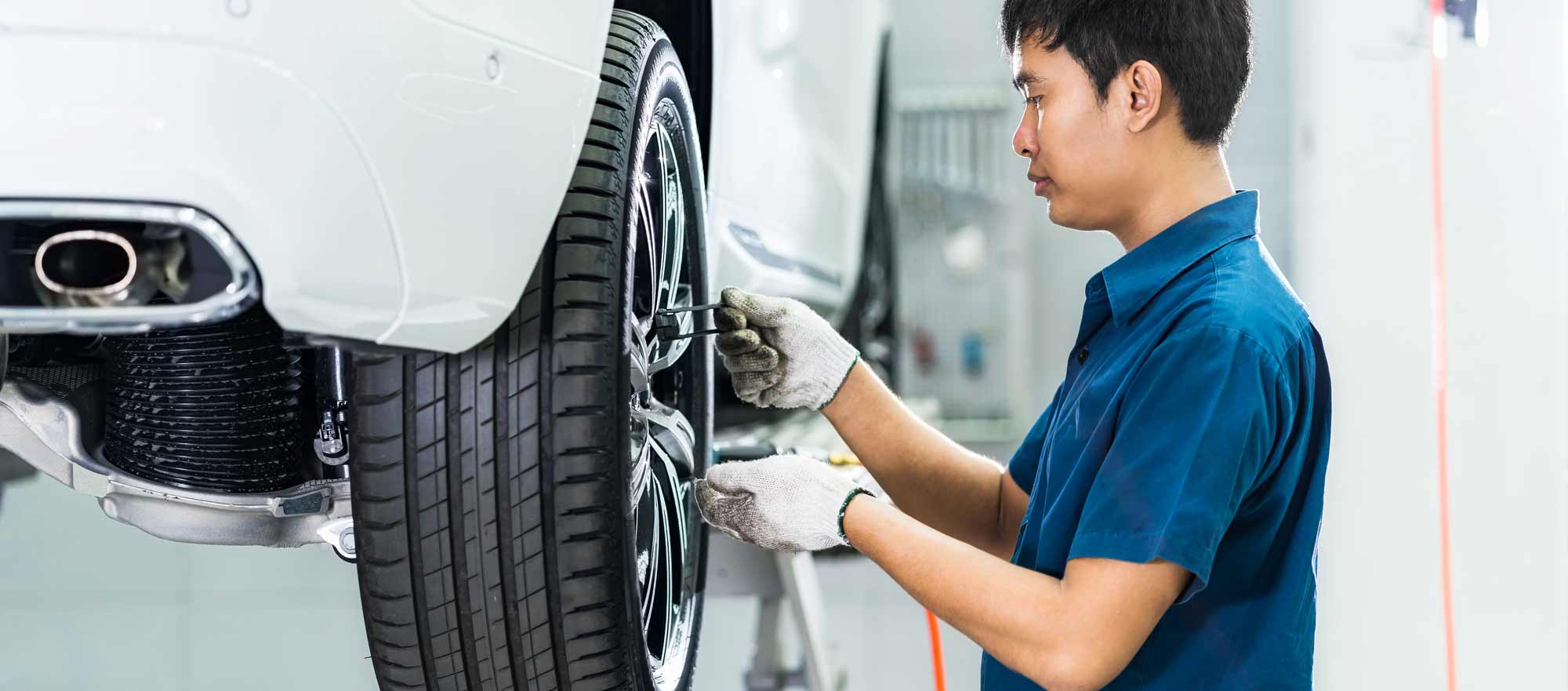 Mechanic checking tire