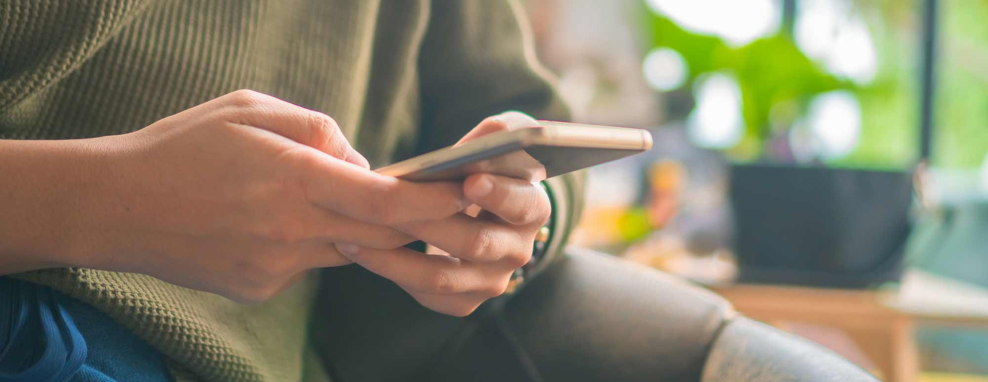 A person scrolling on a mobile phone